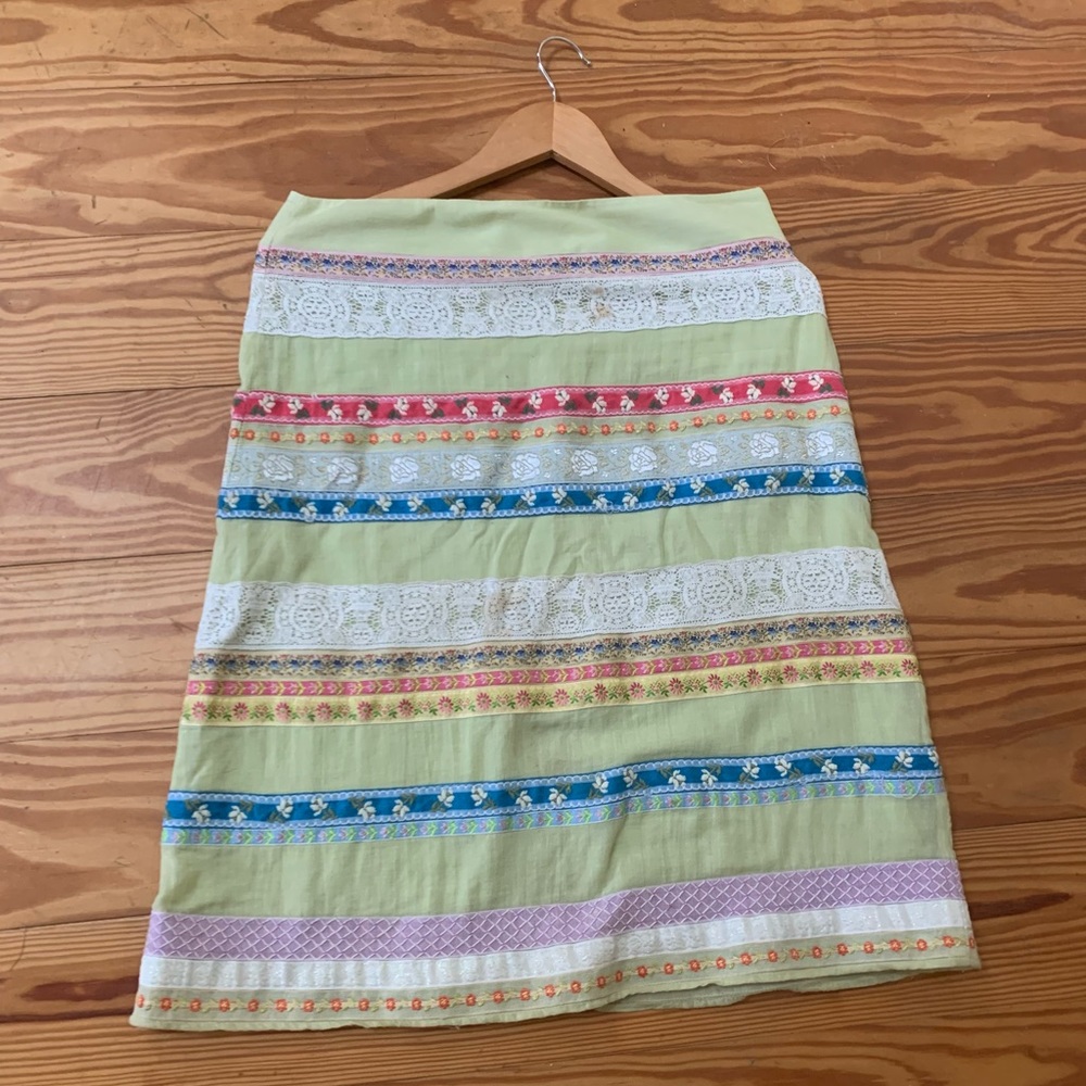 Pamela Brown. Green and floral skirt with lace.